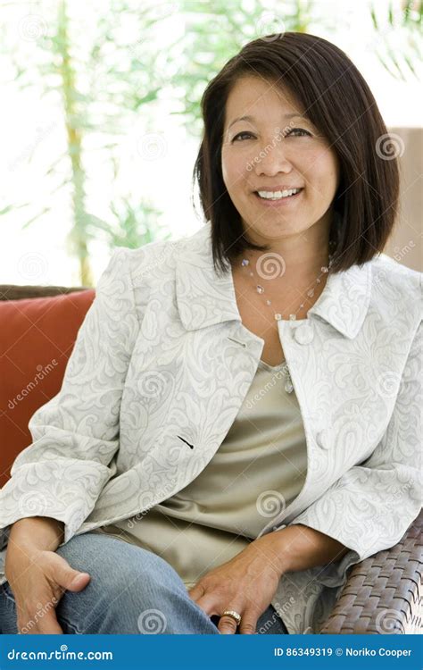 asian mature|Beautiful mature asian woman Stock Photos and Images